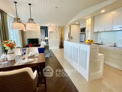 Luxurious open-plan living room and kitchen with elegant decor and modern appliances