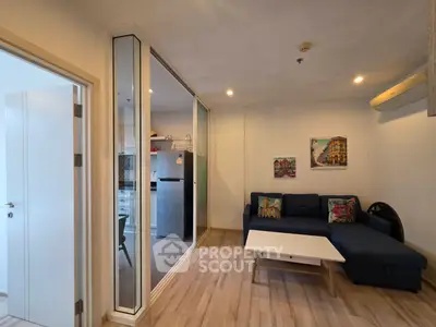 Modern living room with stylish decor and open kitchen layout