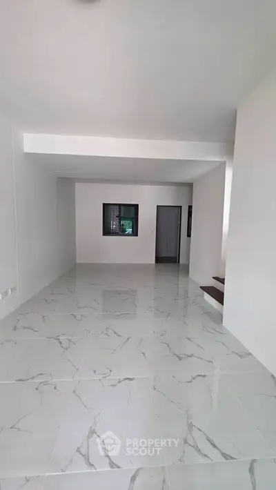 Spacious minimalist interior with marble flooring and modern design