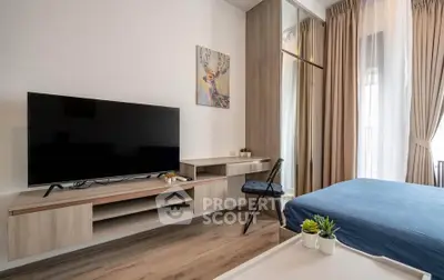 Modern bedroom with sleek TV setup and stylish decor