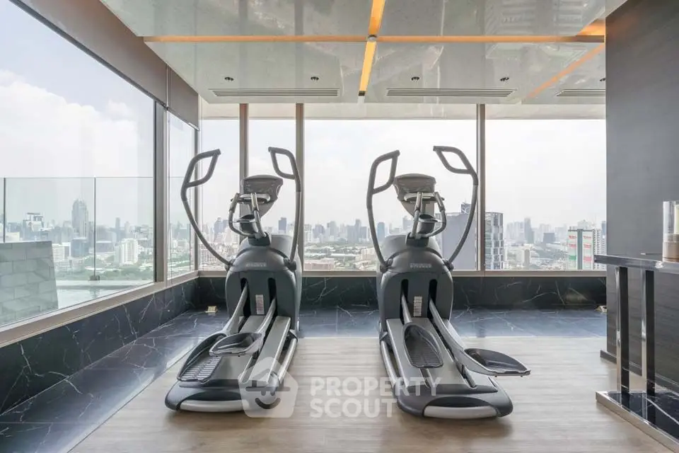 Luxury gym with city skyline view and modern exercise equipment