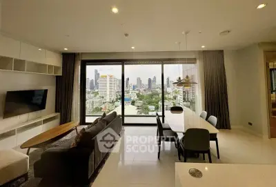 Spacious modern living room with stunning city view and elegant dining area.