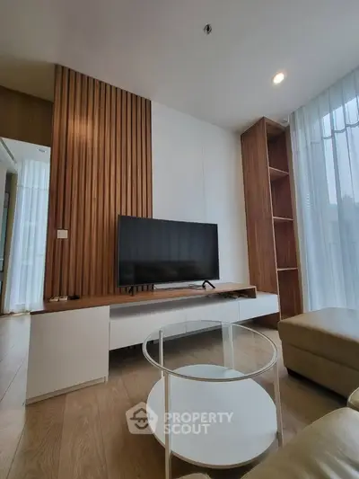 Modern living room with sleek TV stand and wooden accent wall