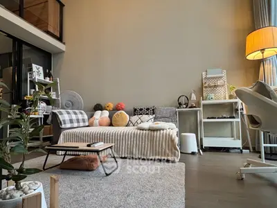 Modern living room with cozy decor and stylish furniture in a spacious apartment.