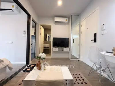 Modern living room with sleek decor and air conditioning in a stylish apartment.