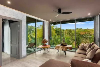 Luxurious living room with panoramic forest views and modern decor