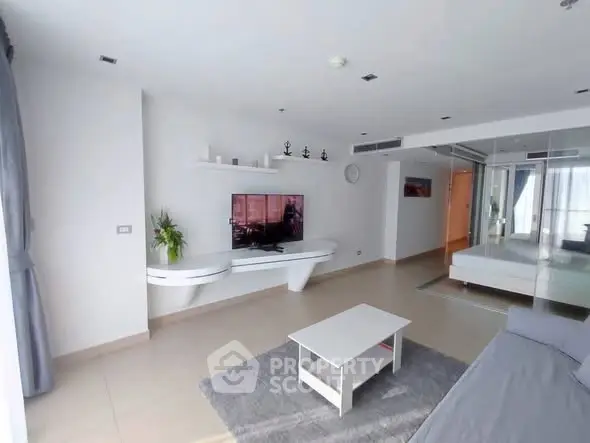 Spacious modern living room with sleek design and ample natural light