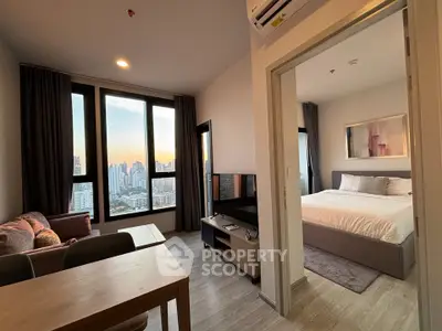 Modern apartment with stunning city view, featuring cozy living room and elegant bedroom.