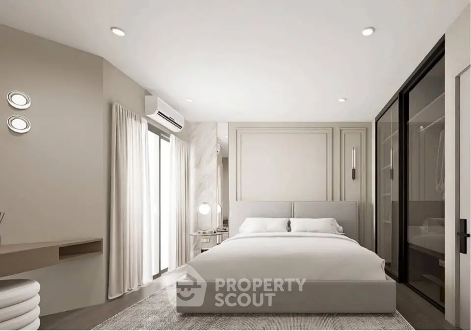 Modern bedroom with sleek design and ample natural light