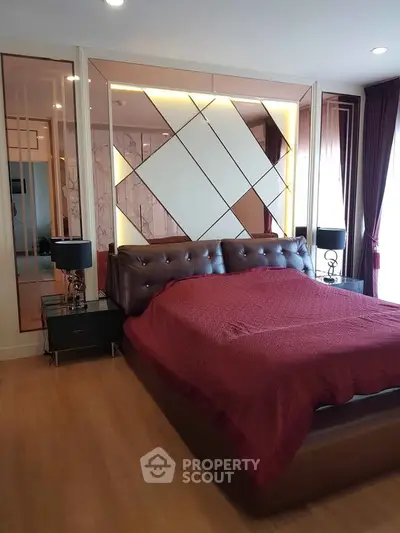 Luxurious bedroom with elegant decor and plush bedding in modern apartment