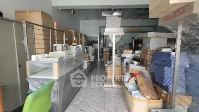 Spacious storage area with boxes and organized shelving, ideal for business or personal use.