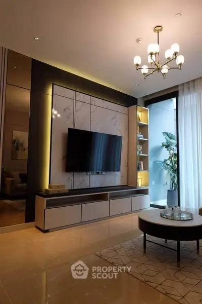 Luxurious modern living room with elegant decor and large TV setup