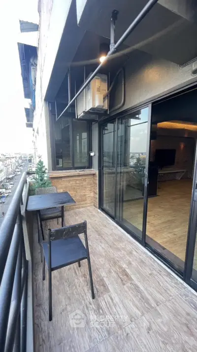 Modern balcony with city view and sliding glass doors