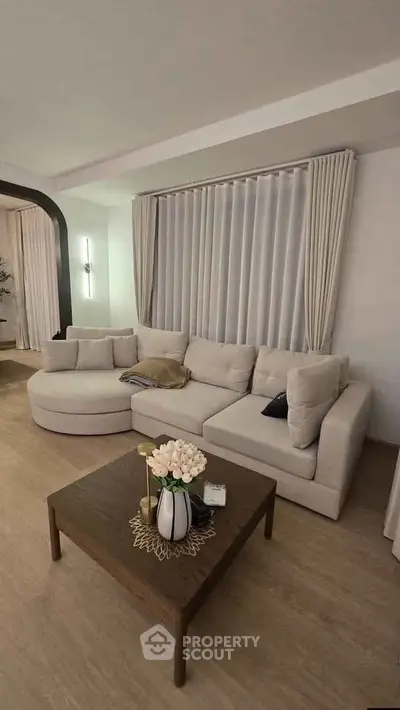 Elegant living room with modern beige sofa and stylish coffee table