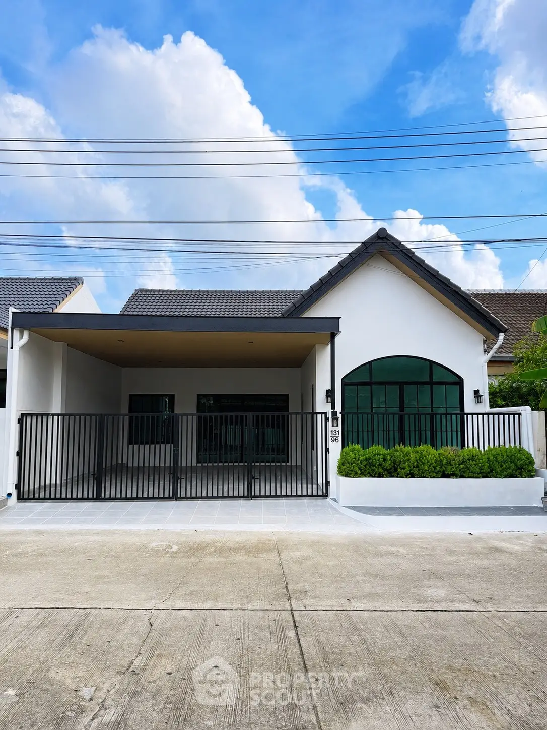Charming single-story house with modern design and spacious driveway, perfect for family living.