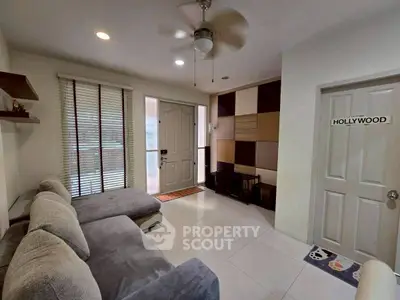 Stylish living room with modern sectional sofa and unique wall decor