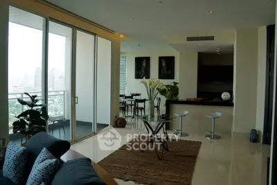 Luxurious modern living room with open layout and city view balcony