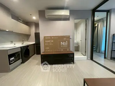 Modern apartment interior with sleek kitchen and new appliances