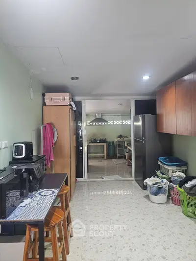 Spacious kitchen with modern appliances and ample storage space, perfect for culinary enthusiasts.