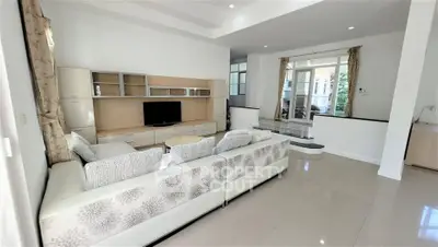 Spacious modern living room with elegant decor and ample natural light