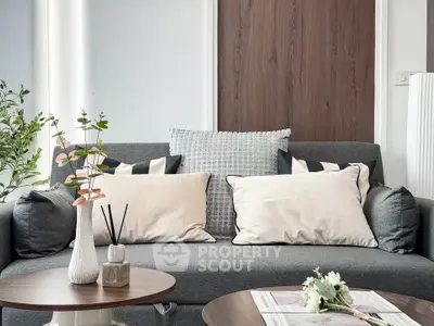 Stylish modern living room with cozy gray sofa and elegant decor