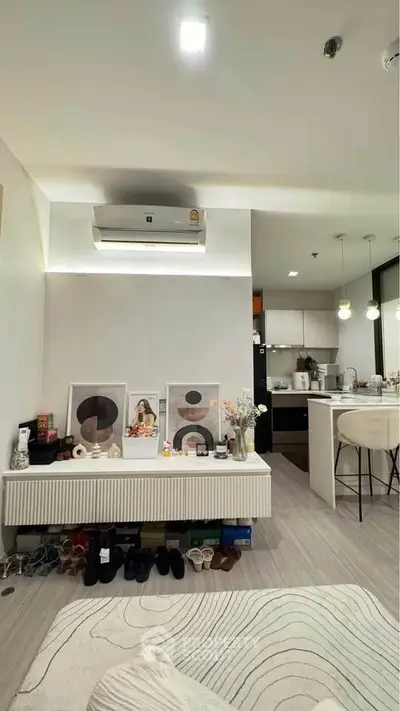 Modern living room with open kitchen layout and stylish decor