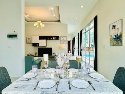Elegant dining area with pool view in modern home