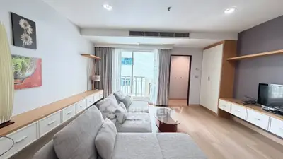 Spacious modern living room with cozy gray sofa and stylish decor