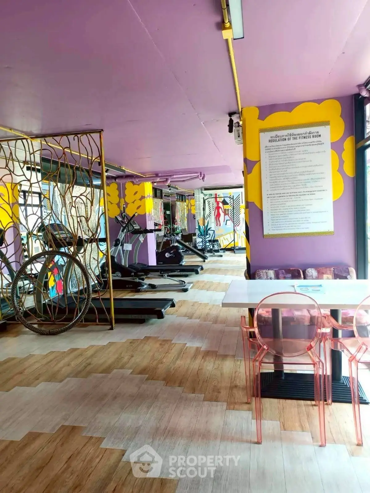 Vibrant gym with modern equipment and colorful decor, perfect for fitness enthusiasts.