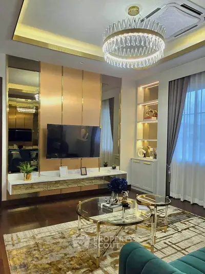 Luxurious living room with elegant chandelier and modern decor, perfect for stylish living.