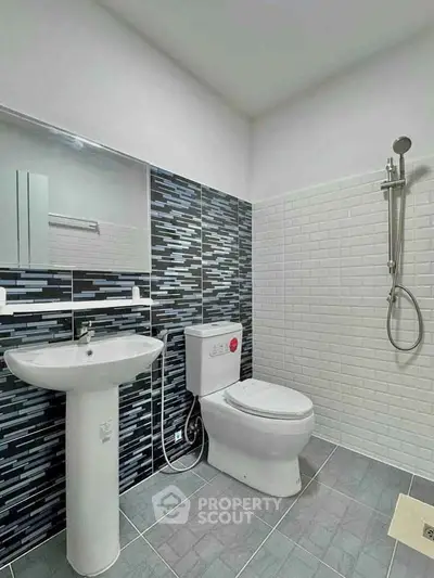 Modern bathroom with sleek design and stylish tile accents