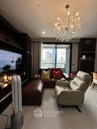 Luxurious living room with chandelier and city view, featuring elegant furniture and modern decor.