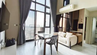 Spacious modern living room with floor-to-ceiling windows and city view