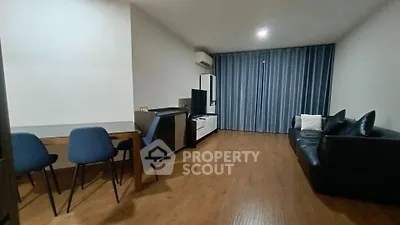 Spacious living room with modern furniture and wooden flooring