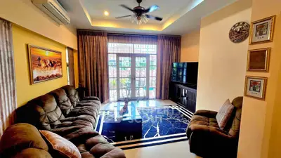 Spacious living room with plush seating and elegant decor, perfect for relaxation and entertainment.