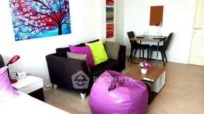 Modern living room with vibrant decor and cozy seating area