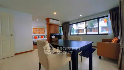 Spacious modern living room with dining area and large windows