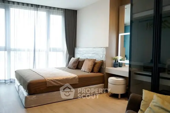 Modern bedroom with large window and stylish decor