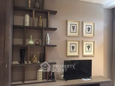 Stylish living room with decorative shelves and modern TV setup