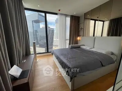 Modern bedroom with stunning city view and floor-to-ceiling windows