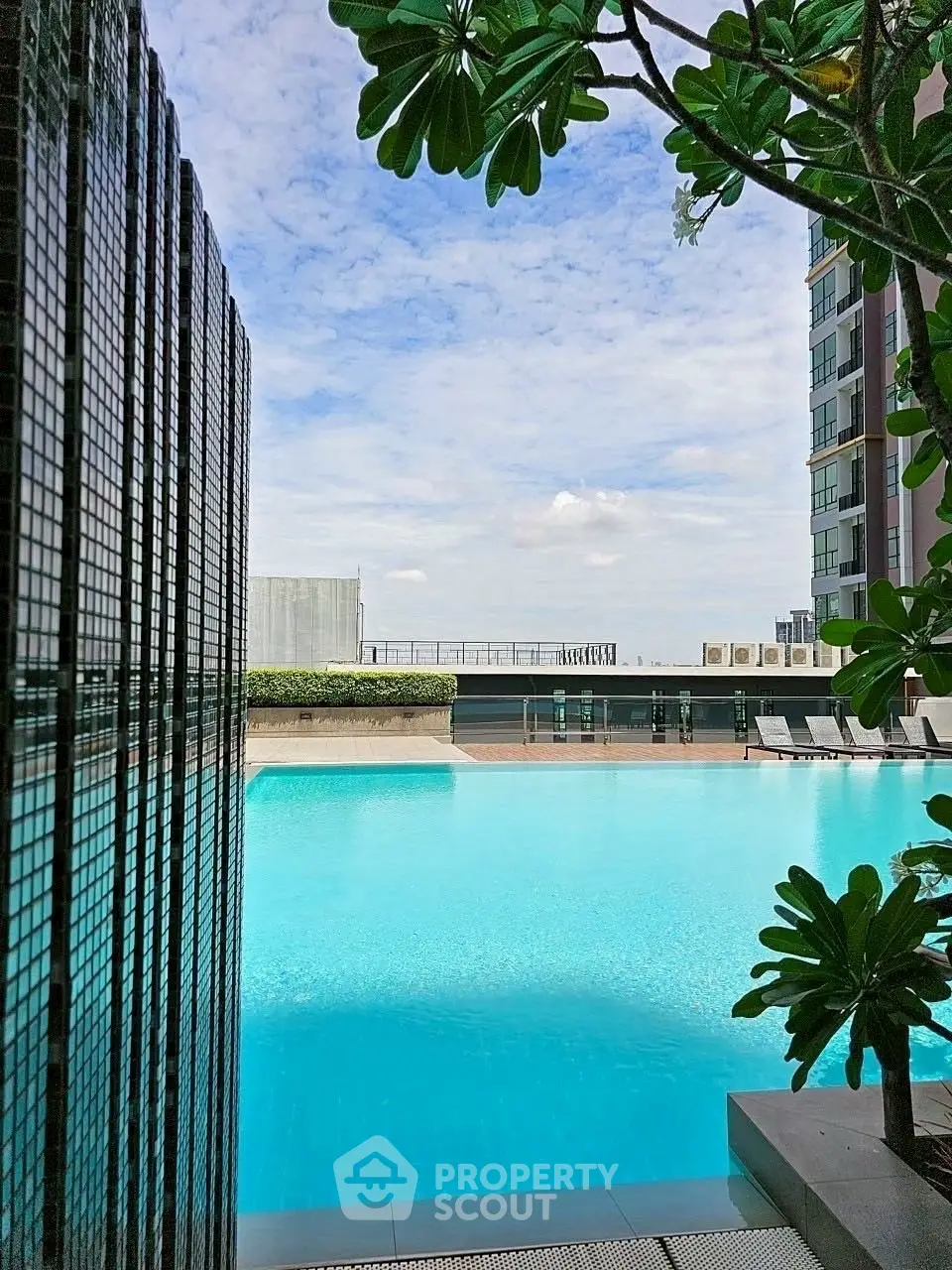 Luxurious rooftop pool with stunning city views and modern design, perfect for relaxation and leisure.