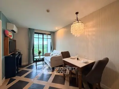 Chic living room with modern decor and large window offering a stunning view, perfect for urban living.