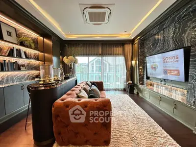 Luxurious living room with plush sofa, elegant decor, and large TV, perfect for modern living.