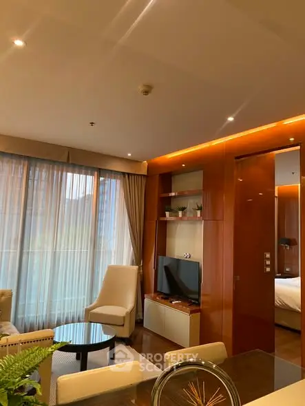 Luxurious living room with modern decor and natural light, featuring elegant furniture and a cozy ambiance.