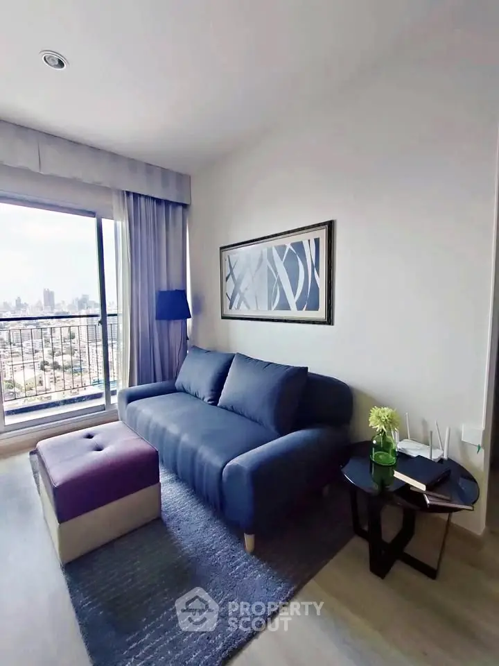 Modern living room with city view, stylish sofa, and chic decor