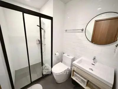 Modern bathroom with sleek shower enclosure and stylish vanity