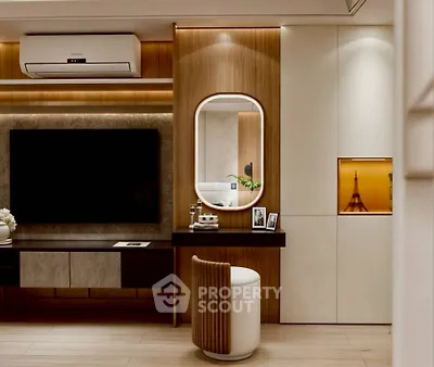 Modern living room with sleek wooden paneling, large TV, and elegant decor.