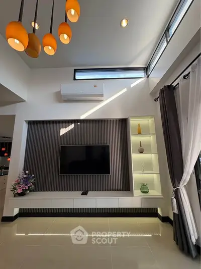 Modern living room with stylish lighting and sleek TV setup