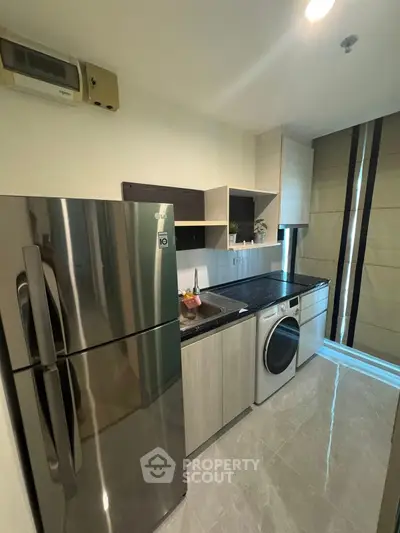 Modern kitchen with sleek appliances and stylish cabinetry