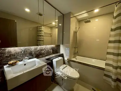 Luxurious modern bathroom with elegant marble accents and sleek fixtures.